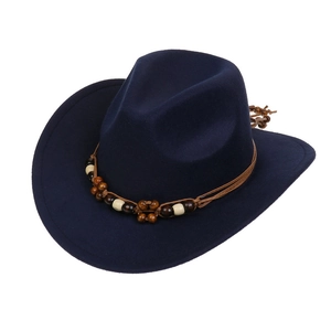 Detail view of dark blue felt cowboy hat featuring intricate wooden bead band decoration