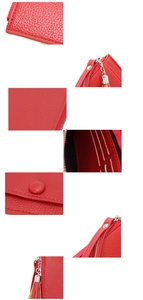 Detail shot of the red faux leather wallet showing the smooth texture and fine stitching