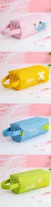 Detailed view of the multi-layered canvas pencil cases with cartoon animal patterns