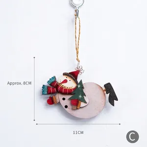 Vintage wooden snowman ornament with red hat and green tree for Christmas tree decoration