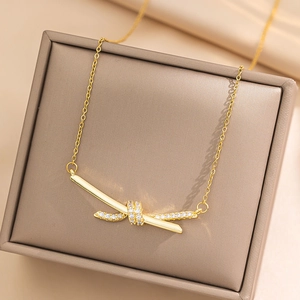 Elegant gold titanium steel knot necklace with sparkling pavé zircon in a jewelry box