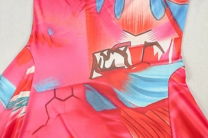 Detail of colorful abstract geometric pattern on long sleeve dress fabric texture