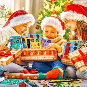 Kids racing car stickers shown as Christmas gifts under a decorated tree