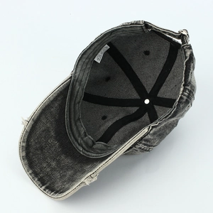 Detailed interior of washed gray denim baseball cap showing 100% cotton label