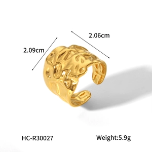 Detailed view of hammered gold stainless steel wide ring with size measurements