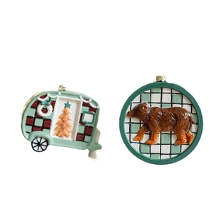 Christmas tree ornaments set featuring a green camper van and a brown bear with plaid details