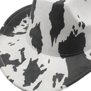 Close-up of cow print cowboy hat showing premium suede texture and stitching detail