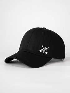 Close-up of premium cotton twill with white crossed golf club logo on black baseball cap