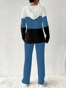 Detail view of back side of three-color ribbed knit hoodie and matching pants set
