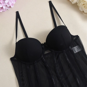 Detail of black mesh corset top with underwire cups and supportive boning structure