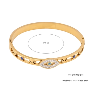 Detail showing dimension 6x5cm and gold stainless steel snake bracelet with blue eye