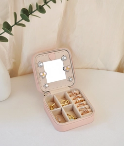 Pink PU leather travel jewelry box with mirror, velvet lining and zipper closure