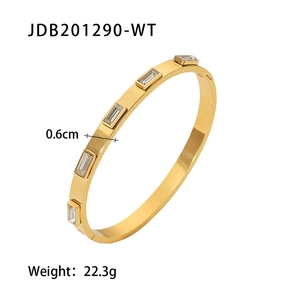 Detailed size view of a 0.6cm wide wavy 18K gold plated steel cuff with square zircon