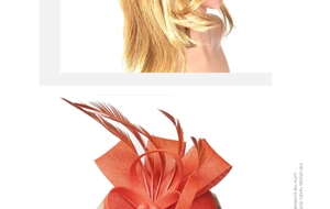 Detailed close-up of vibrant orange fascinator hat with feather and mesh bow texture