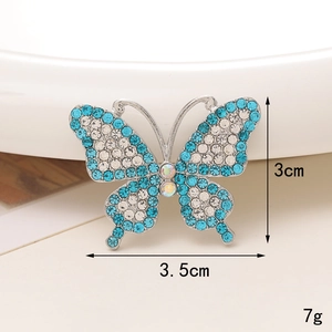 Detail showing dimensions and 7g weight of blue and white butterfly rhinestone charm