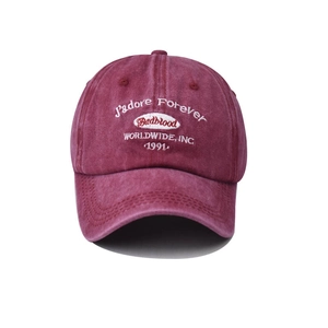 Close-up of J'adore Forever and Badblood logo embroidery on washed cotton baseball cap