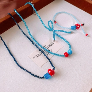 Beaded mushroom and bowknot necklace set with blue glass charms for women
