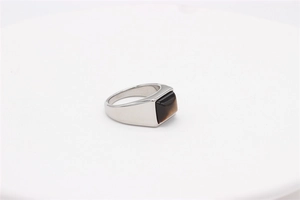 Detailed view of square tiger eye gemstone set in a vintage polished stainless steel ring