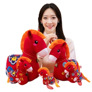 Group of festive Chinese style red plush horse toys with embroidery and golden bells