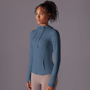 Detail of slate blue hooded sports jacket featuring ergonomic thumbholes on sleeves