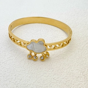Golden stainless steel clover bangle with white shell cloud and star cutout design
