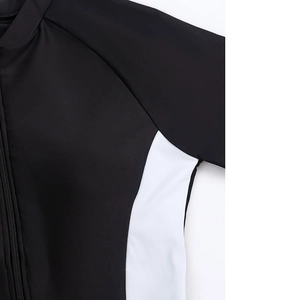 Detail of color-block athletic swimsuit with front zipper and reinforced stitching