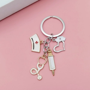 Detailed shot of nurse-themed keychain with stethoscope, syringe and cap charms