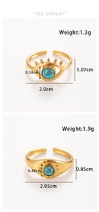Detail view of gold adjustable rings featuring evil eye and sun patterns with turquoise inlay
