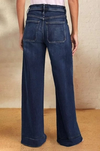 Detail view of high waist wide leg blue denim jeans showing the back pocket design