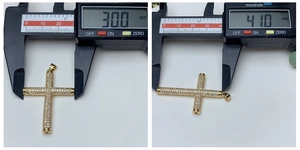 Detailed measurement of 18k gold cross pendant with cubic zirconia using digital caliper