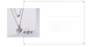Detail of 18k gold plated stainless steel heart mama necklace and stud earrings set