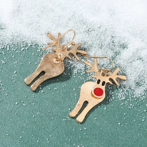 Detail of Christmas reindeer ear hooks in gold alloy with red and black enamel accents