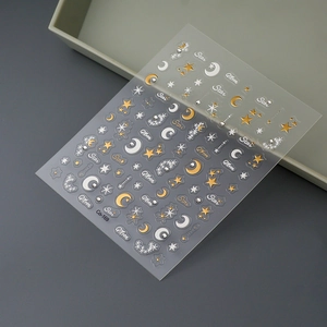 Detailed view of Co-169 gold and silver star and moon adhesive nail art stickers
