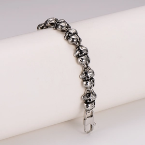 Retro stainless steel skull bracelet for men featuring a classic lobster clasp design