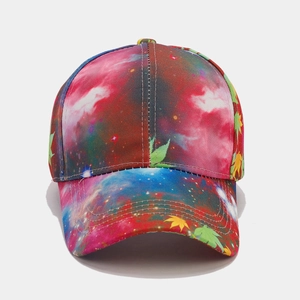 Detailed view of galaxy print baseball cap featuring vibrant cannabis leaf embroidery