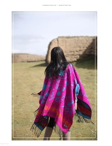 Detailed embroidery and fringe on thick ethnic rose red cashmere shawl for travel