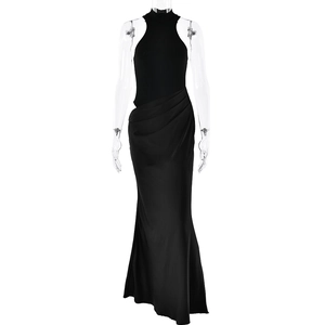 Detail of black sleeveless satin maxi dress with elegant pleats on a mannequin