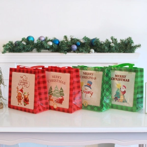 Set of four reusable Christmas non-woven gift bags with festive reindeer and Santa prints