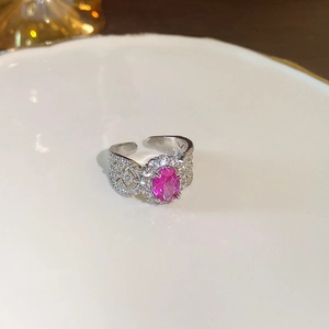 Macro view of a 925 silver ring featuring a pink oval gemstone and hollow pave setting