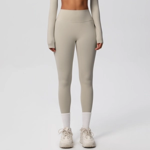 Close-up of high-waisted seamless yoga pants in light oatmeal grey with a wide waistband