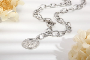 Silver stainless steel chain necklace with Virgin Mary pendant and toggle clasp detail