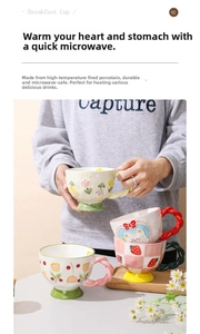 Macro detail of hand-painted embossed ceramic mug showing flower and bear patterns