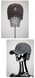 Detail of winter baseball cap showing ear flaps and textured wool blend fabric