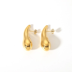Detailed close-up of shiny 18K gold-plated teardrop earrings with a smooth metallic finish
