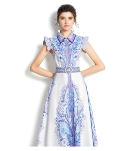 Detail of white paisley dress showing lapel collar, ruffled sleeves and matching belt