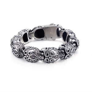 Men's vintage silver stainless steel bracelet featuring retro skull hollow patterns
