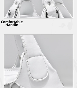 Close-up of white grain leather handbag handle with silver metal ring hardware details
