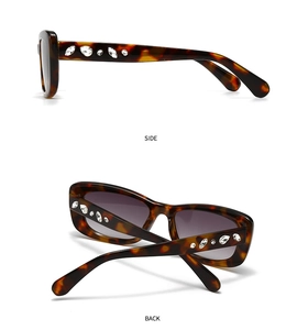 Detail view of tortoiseshell sunglasses frame with side rhinestone crystal embellishments