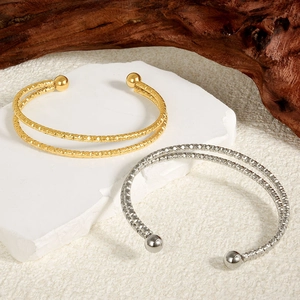 Double-layered 18k gold and silver stainless steel open bangles with hammered texture