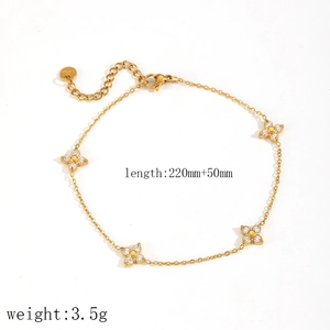 Detail view of gold clover bracelet with zircon inlay and product measurements